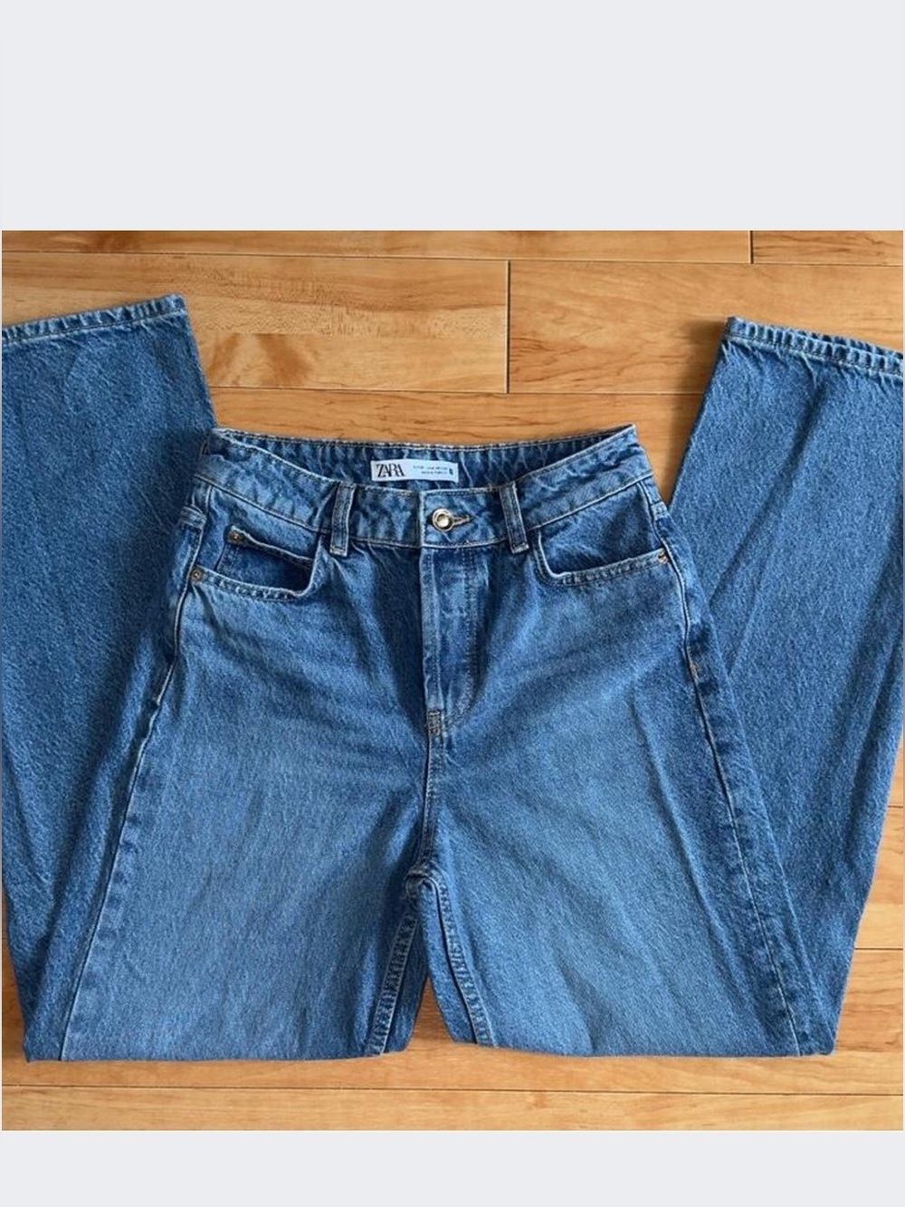 Zara high rise relaxed fit mid-blue jeans with multiple buttons closure
